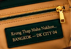 Bangkok Emerald Green. Interior: Single zip pocket, no card slots.